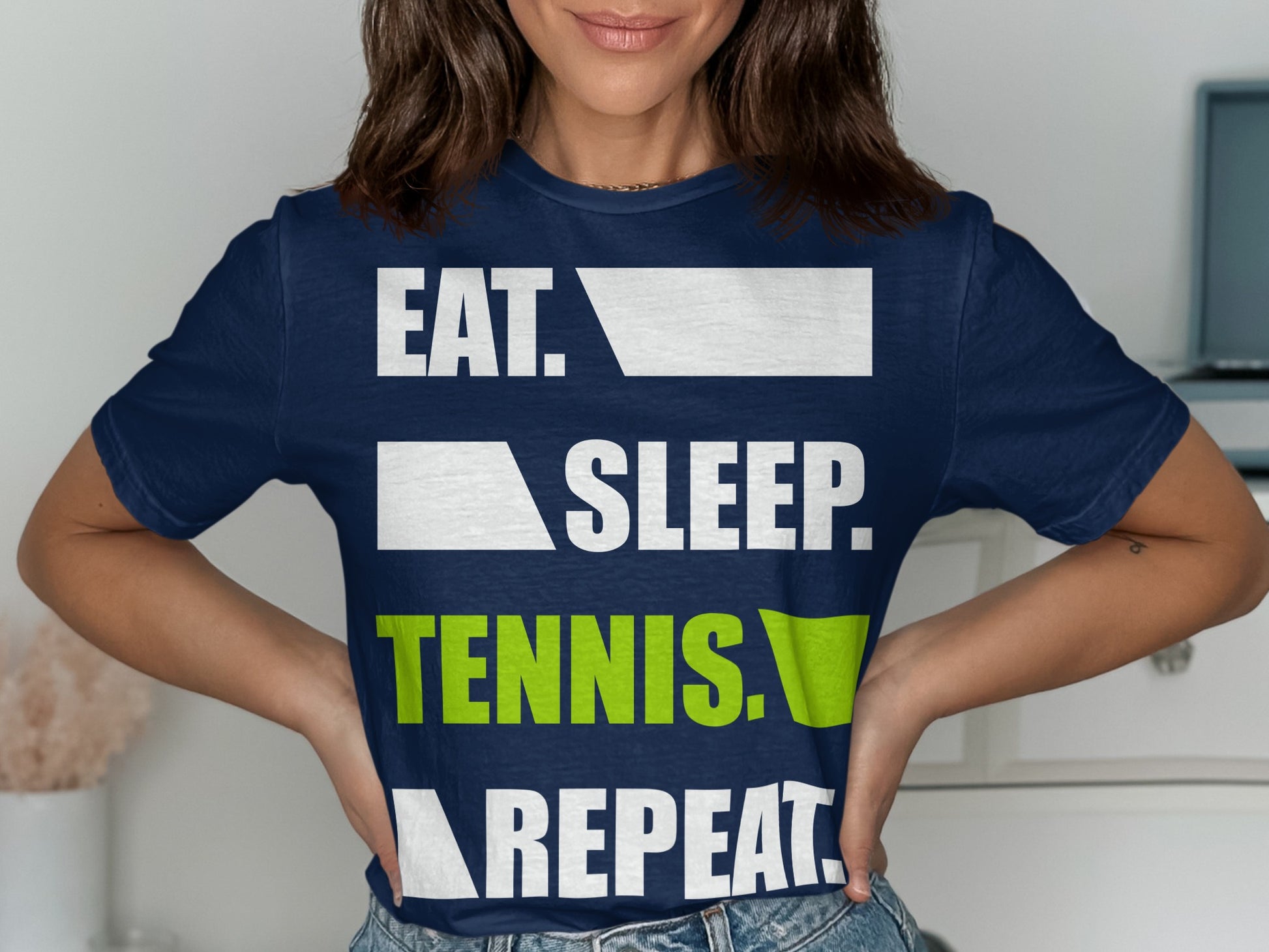 Navy t-shirt with "EAT. SLEEP. TENNIS. REPEAT." text.
