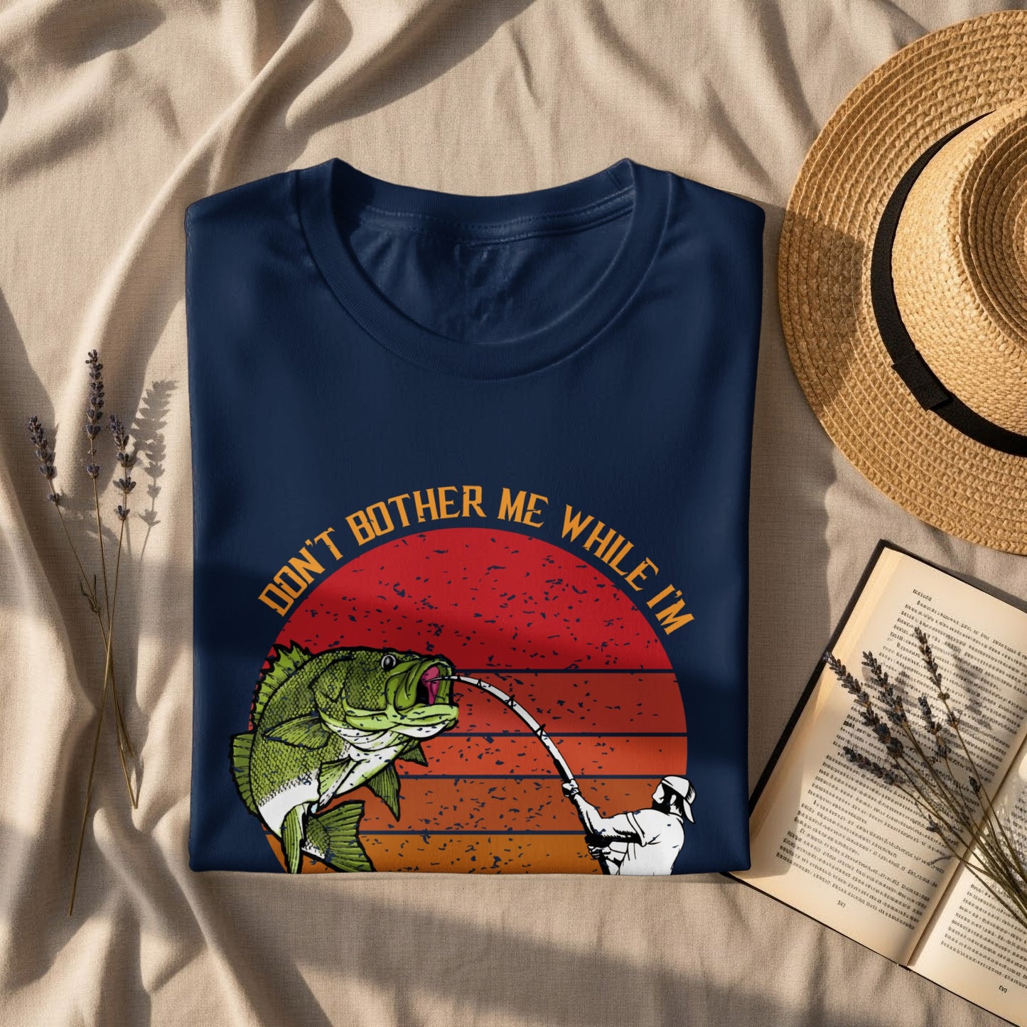 Navy t-shirt with a bass fishing graphic and "Don't Bother Me While I'm Fishing" text.