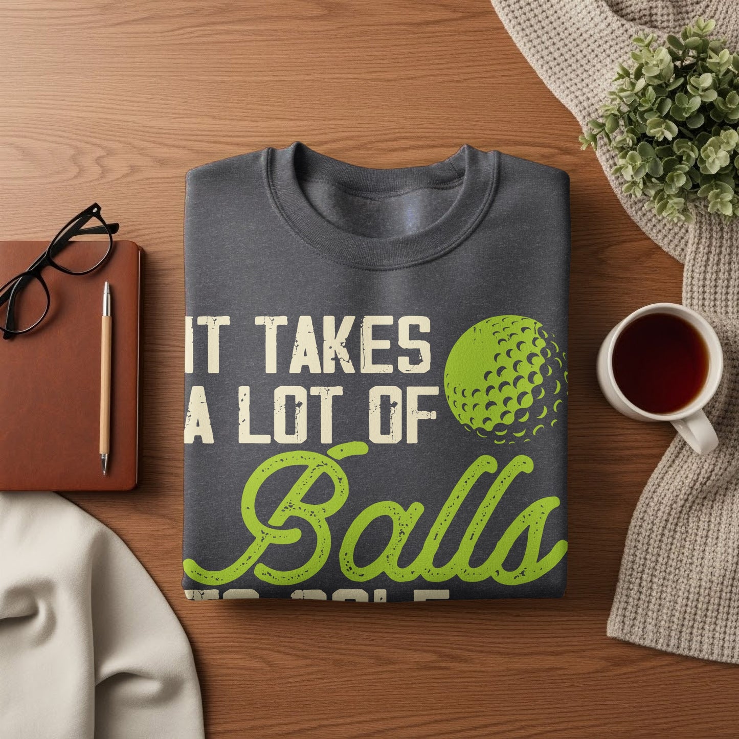Dark gray sweatshirt with "It Takes a Lot of Balls" and a golf ball graphic.