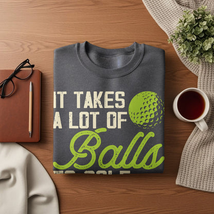 Dark gray sweatshirt with "It Takes a Lot of Balls" and a golf ball graphic.