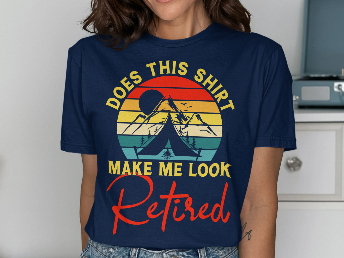 Shirt with "DOES THIS SHIRT MAKE ME LOOK RETIRED?" text and camping graphic.