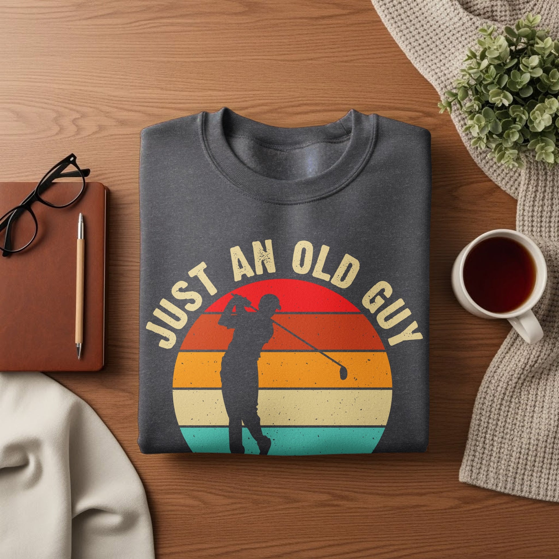 Dark gray sweatshirt with "Just an old guy" text and golfer silhouette.