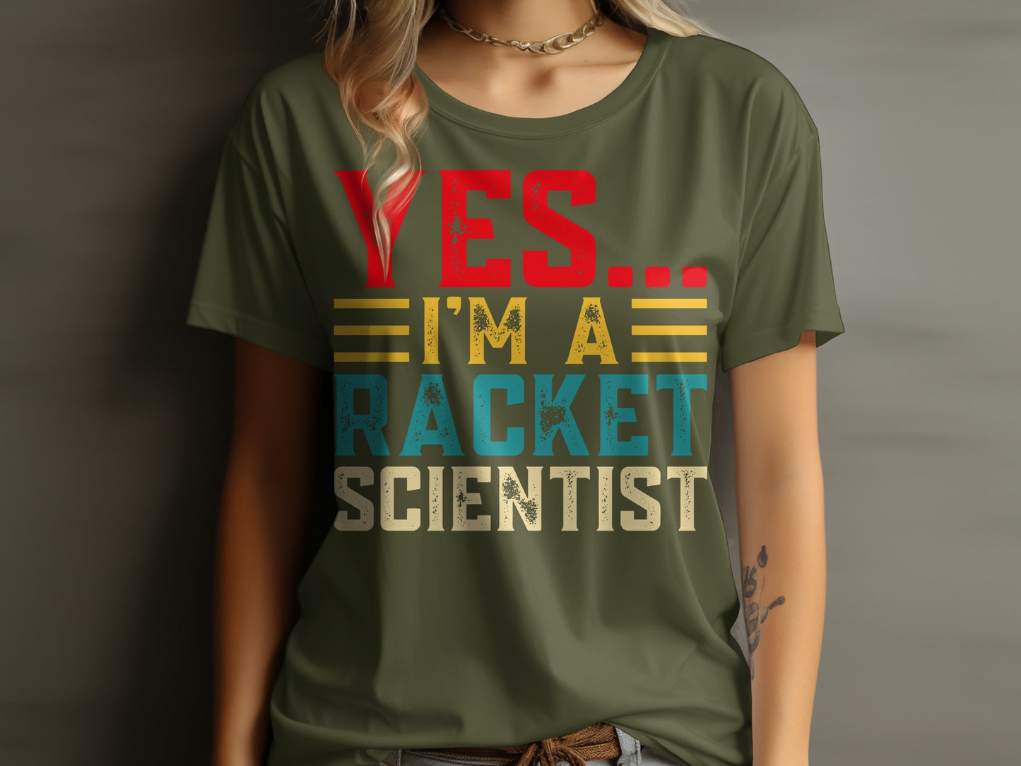 Green t-shirt with red "YES" and "I'M A RACKET SCIENTIST" text.