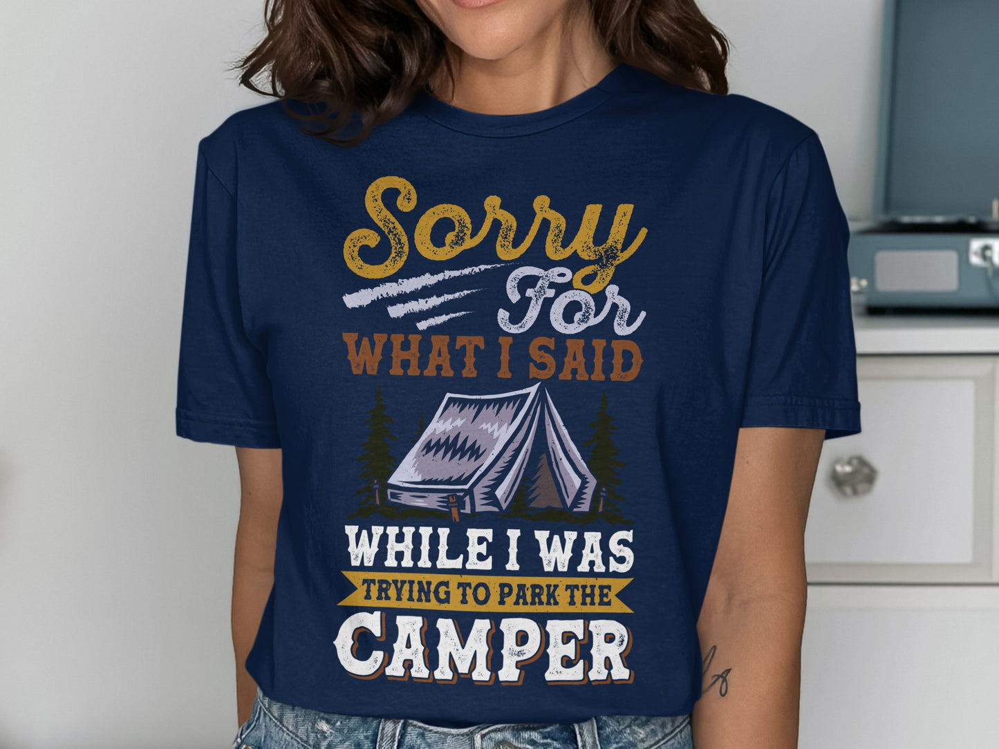 Navy t-shirt with "Sorry For What I Said While I Was Trying To Park The Camper" text and tent graphic.