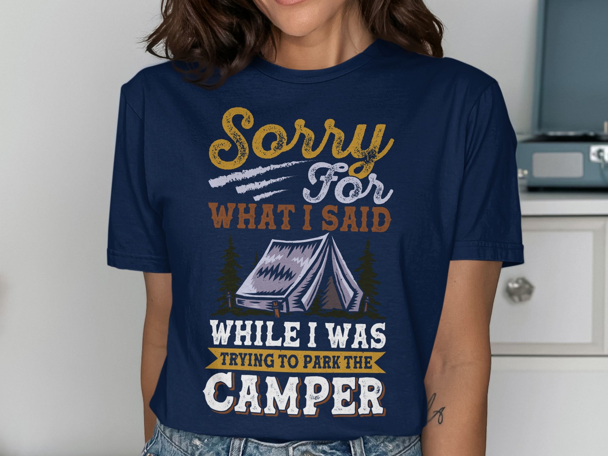 Navy t-shirt with "Sorry For What I Said While I Was Trying To Park The Camper" text and tent graphic.
