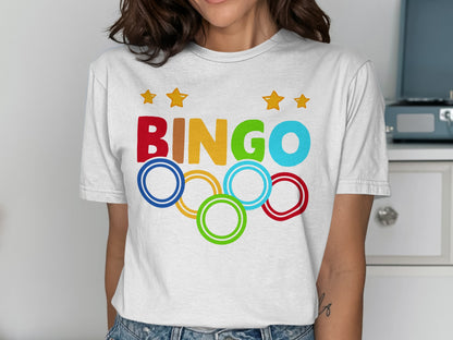 White t-shirt with "BINGO" text and Olympic rings.