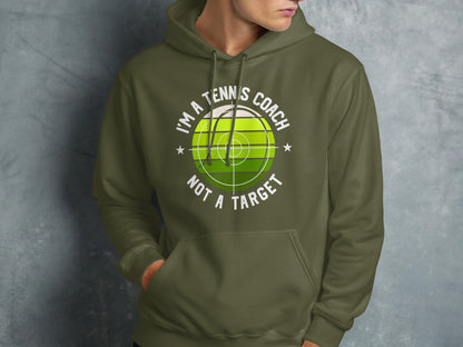 Green hoodie with "I'm a tennis coach, not a target" text and a bullseye graphic.