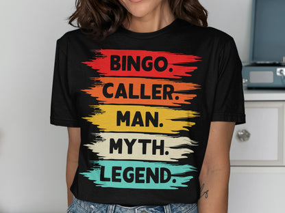 Black t-shirt with "BINGO. CALLER. MAN. MYTH. LEGEND." in colorful brush strokes.
