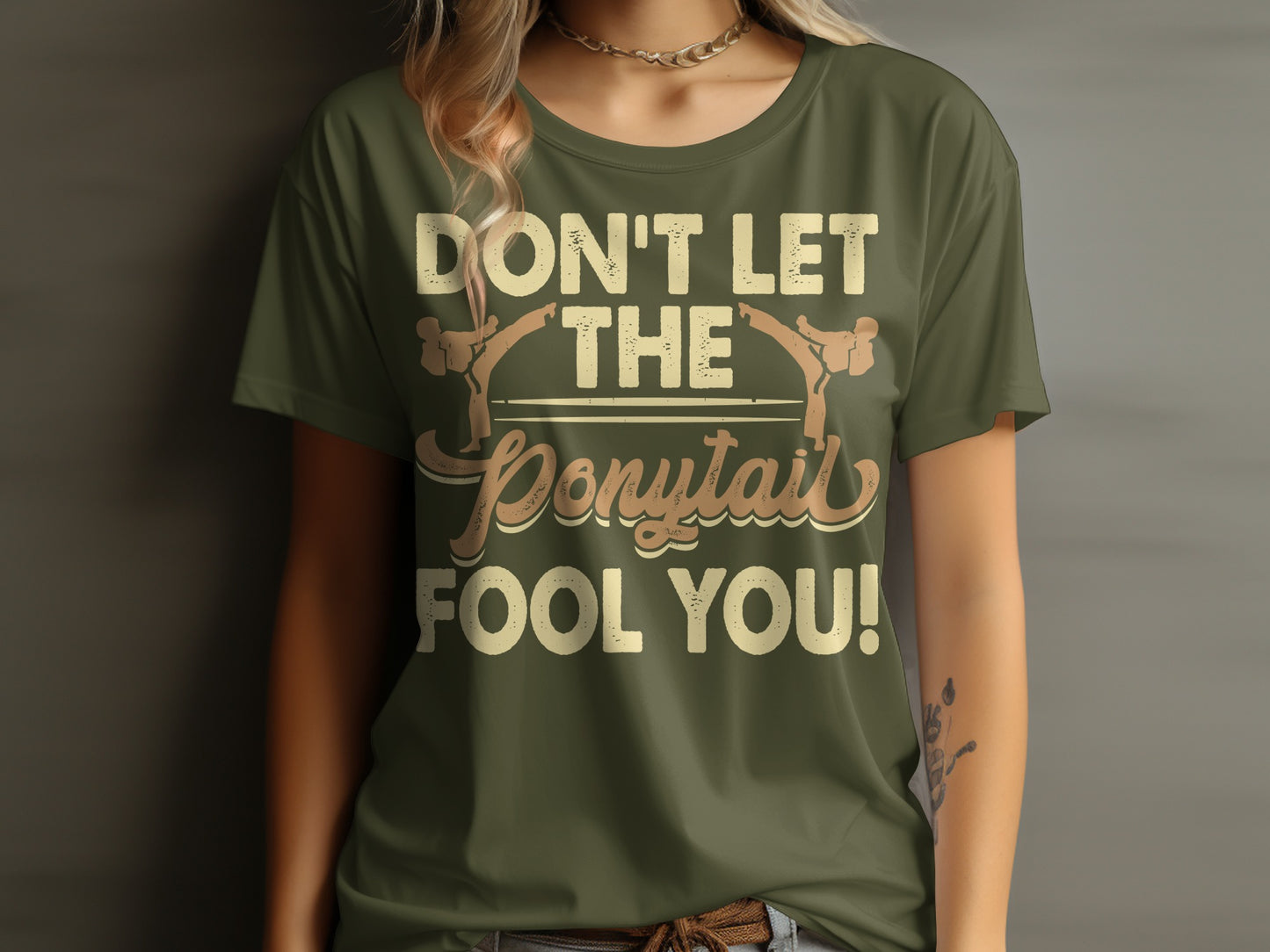 Green t-shirt with "DON'T LET THE Ponytail FOOL YOU!" text.