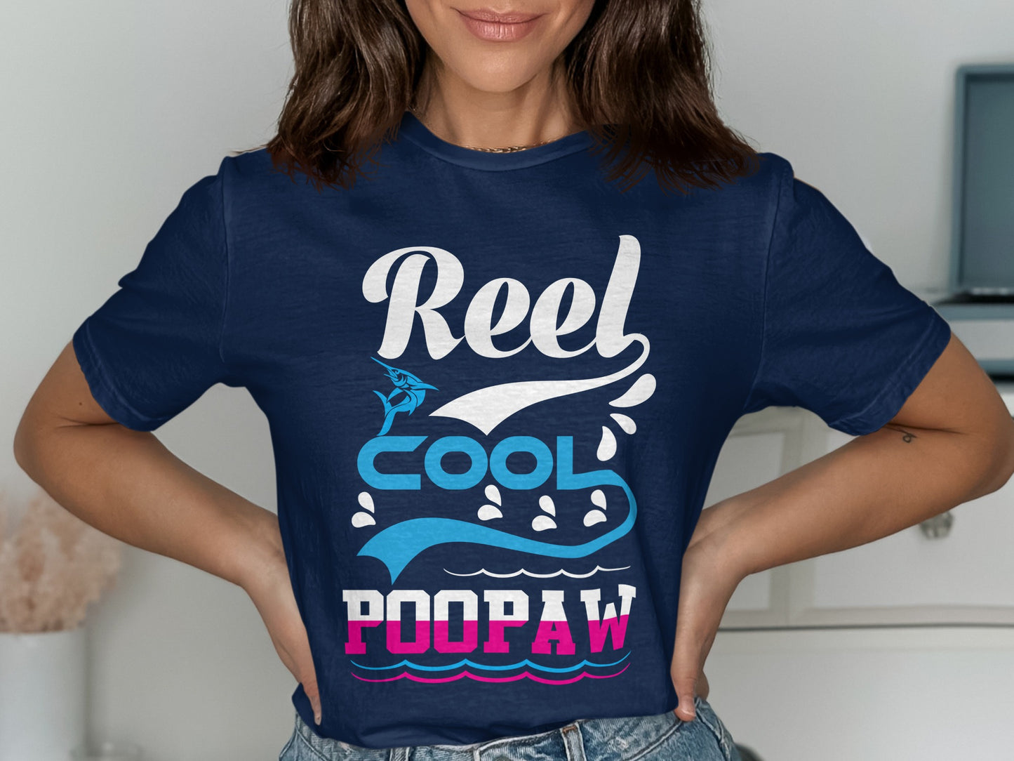 Navy t-shirt with "Reel Cool POOPAW" text and fish graphics.