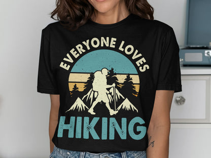 T-shirt with "EVERYONE LOVES HIKING" and mountain graphic.