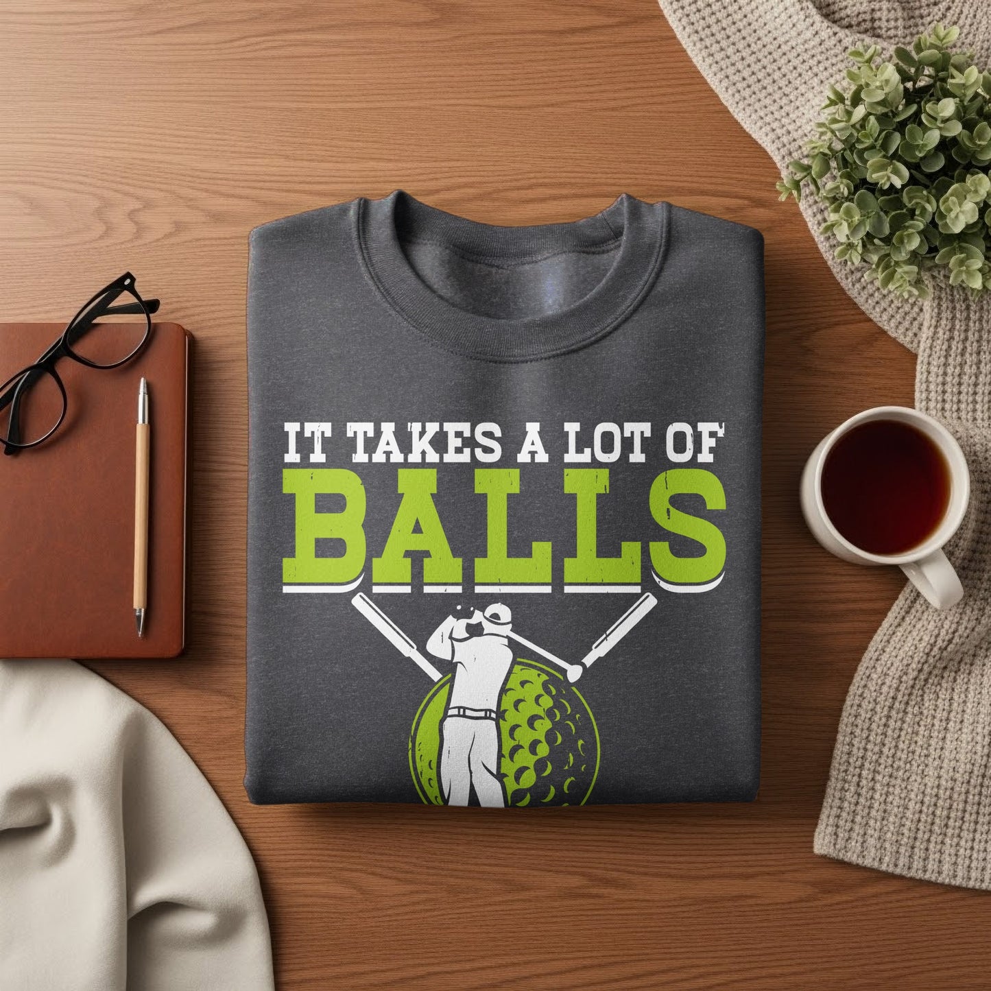 Dark gray sweatshirt with "It Takes a Lot of Balls" and golf graphics.