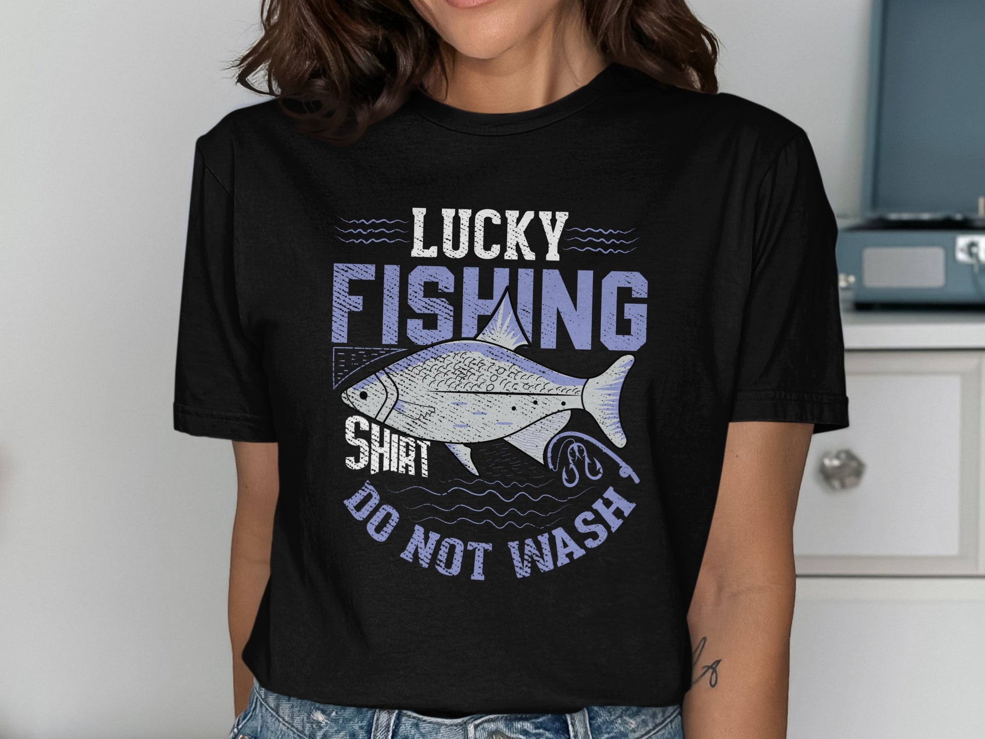 T-shirt with "LUCKY FISHING SHIRT DO NOT WASH" text and fish graphic.