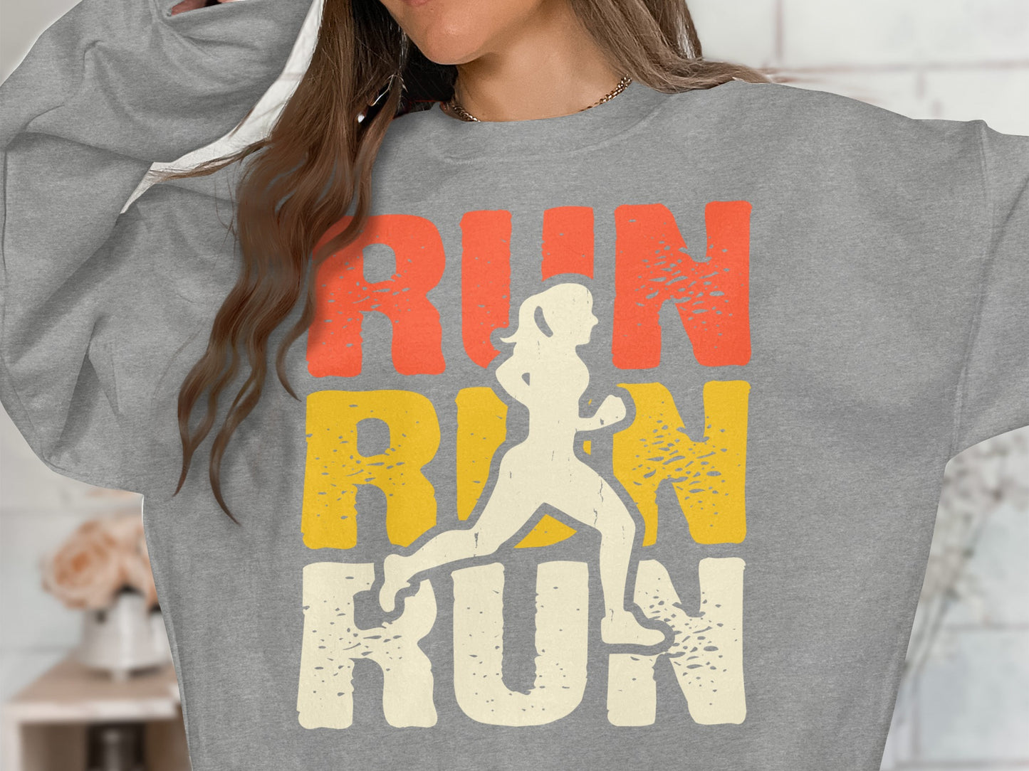 Gray sweatshirt with "RUN RUN RUN" text and a silhouette of a runner.