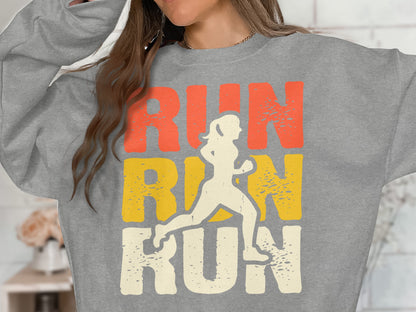 Gray sweatshirt with "RUN RUN RUN" text and a silhouette of a runner.