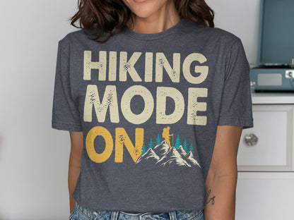 Dark grey t-shirt with "HIKING MODE ON" text and mountain graphic.
