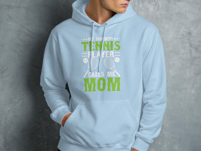 Light blue hoodie with "My Favorite Tennis Player Calls Me Mom" text and graphics.