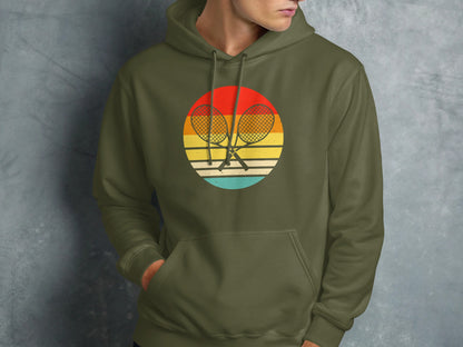 Circle logo with crossed tennis rackets and sunset design on olive green hoodie.