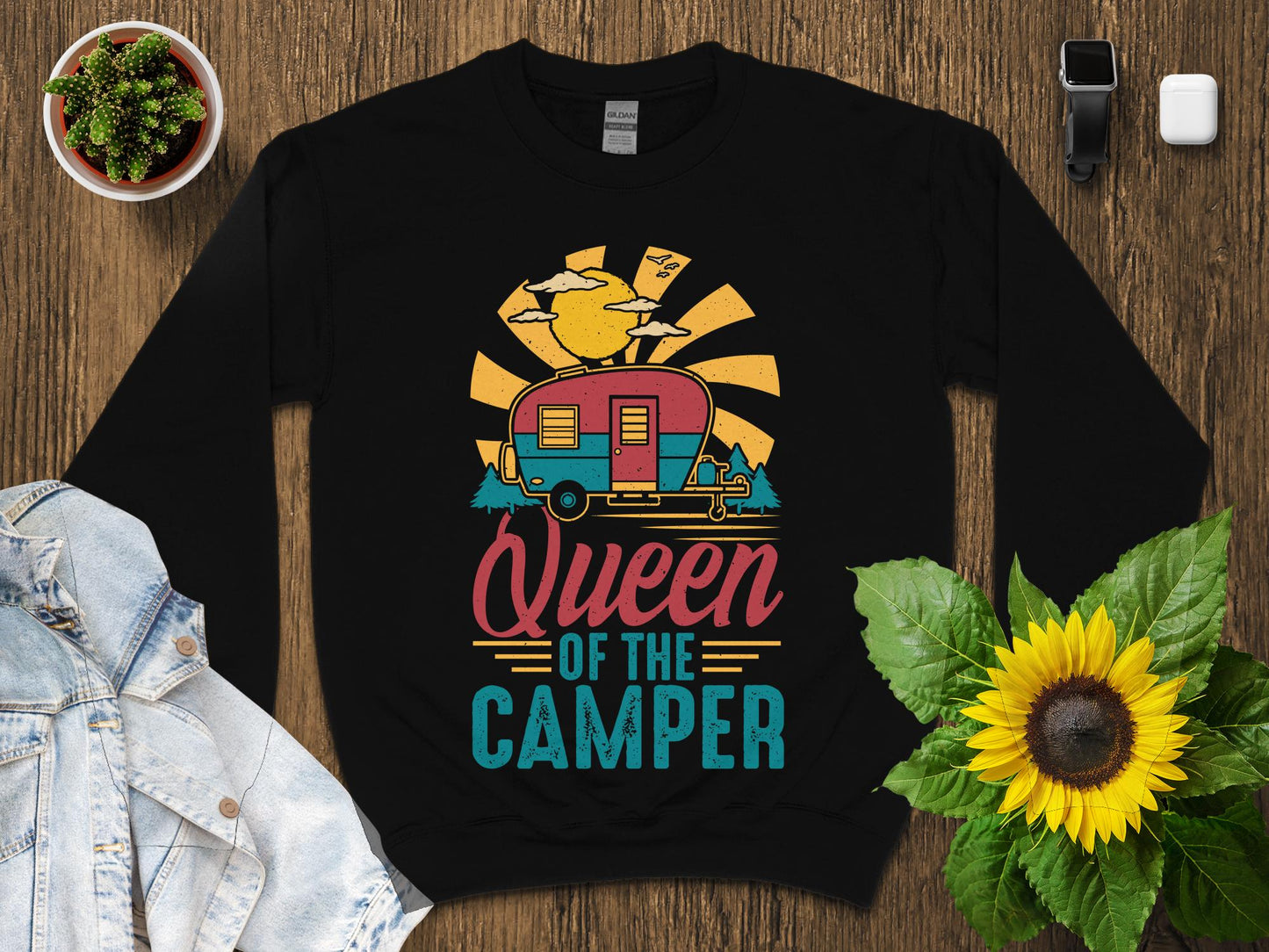Black sweatshirt with "Queen of the Camper" design featuring a retro camper and sun.