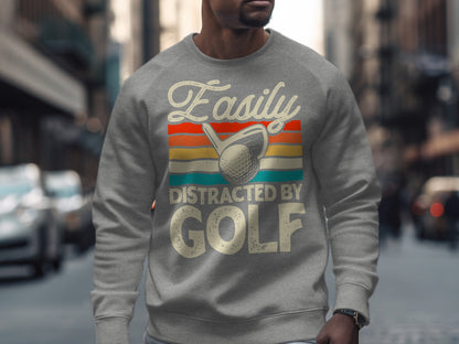 Gray sweatshirt with "Easily Distracted By GOLF" text and vintage golf ball graphic.