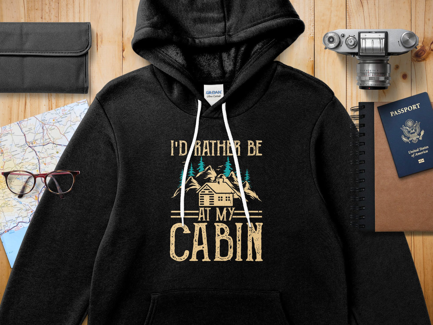 Gildan Ultra Cotton black hoodie with "I'd Rather Be At My Cabin" text.