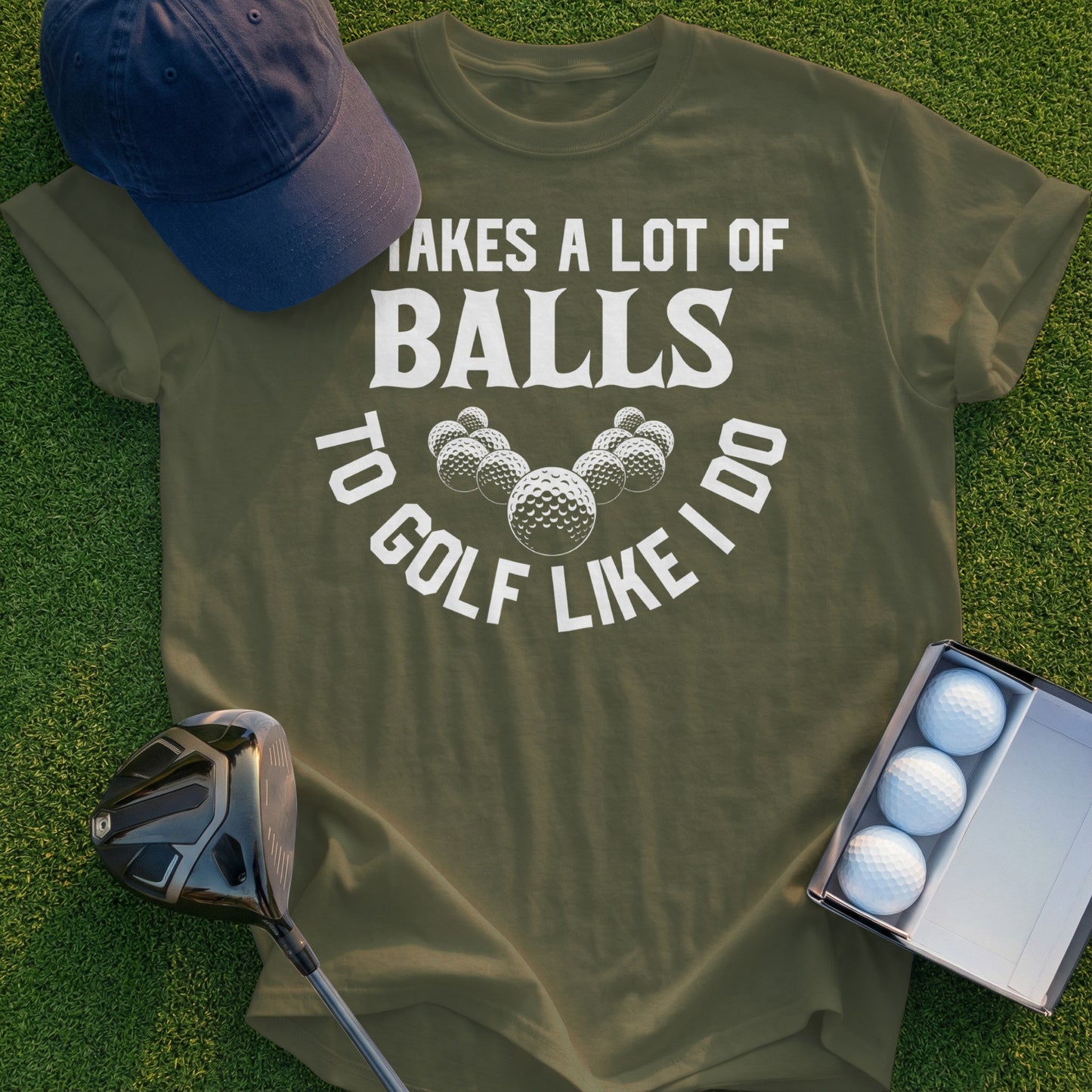 Olive t-shirt with "Takes a lot of balls to golf like I do" and golf ball graphics.
