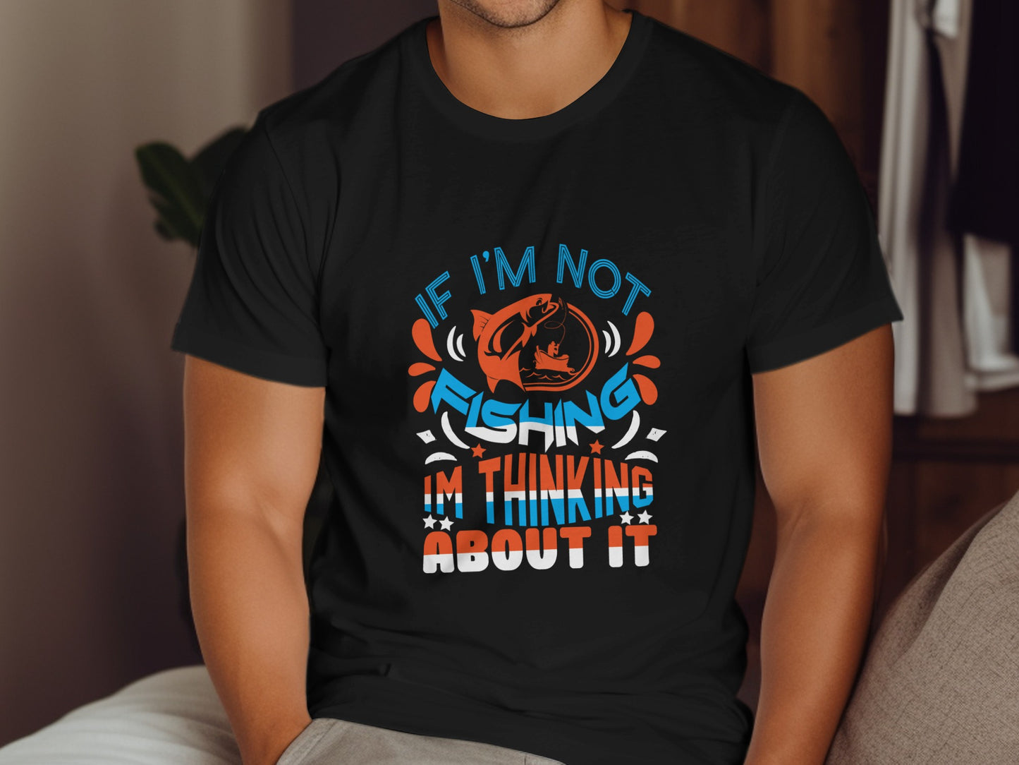 Black t-shirt with "If I'm not fishing, I'm thinking about it" text.