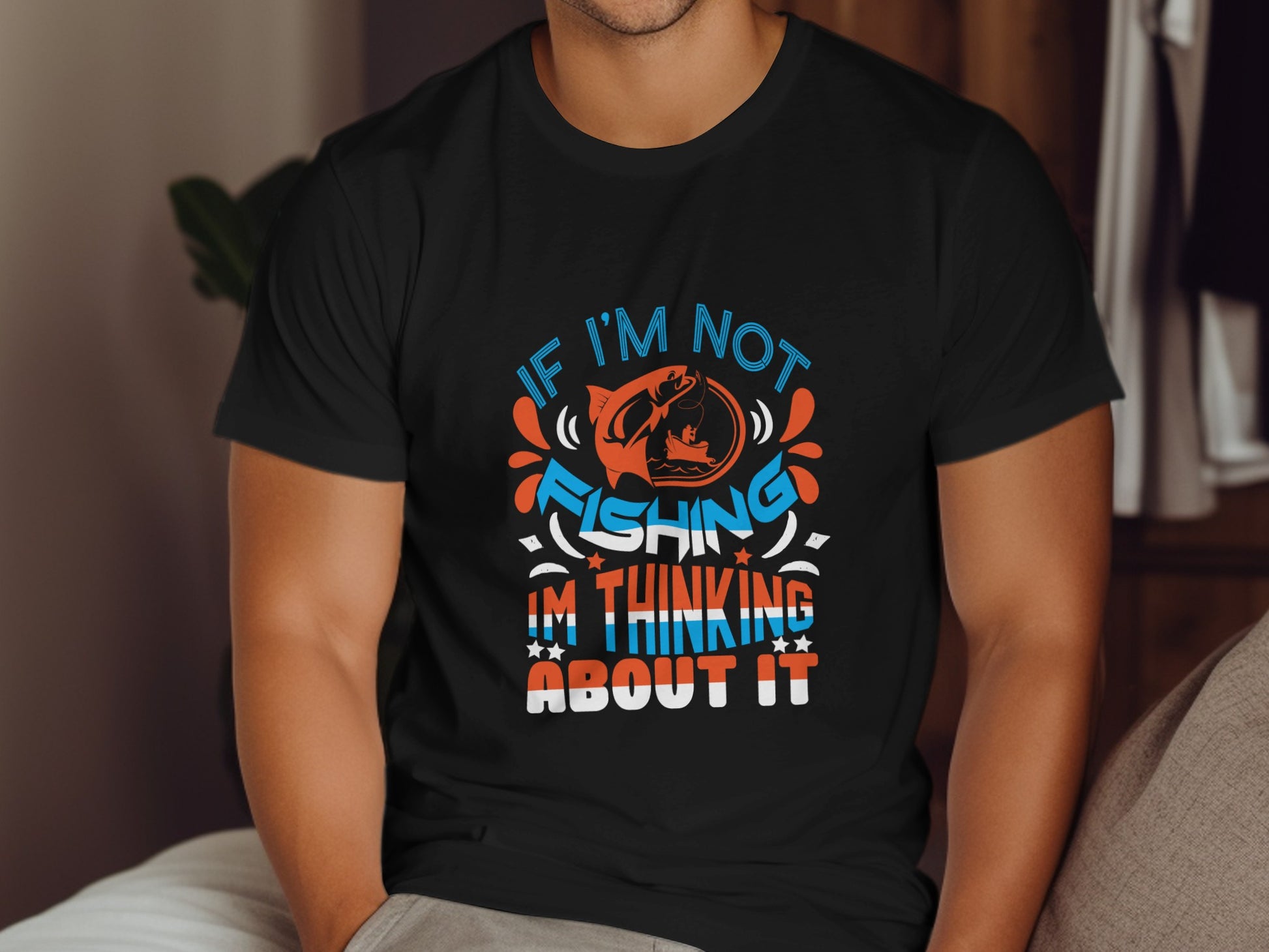 Black t-shirt with "If I'm not fishing, I'm thinking about it" text.