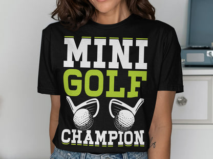 T-shirt with "MINI GOLF CHAMPION" text and two golf club heads.