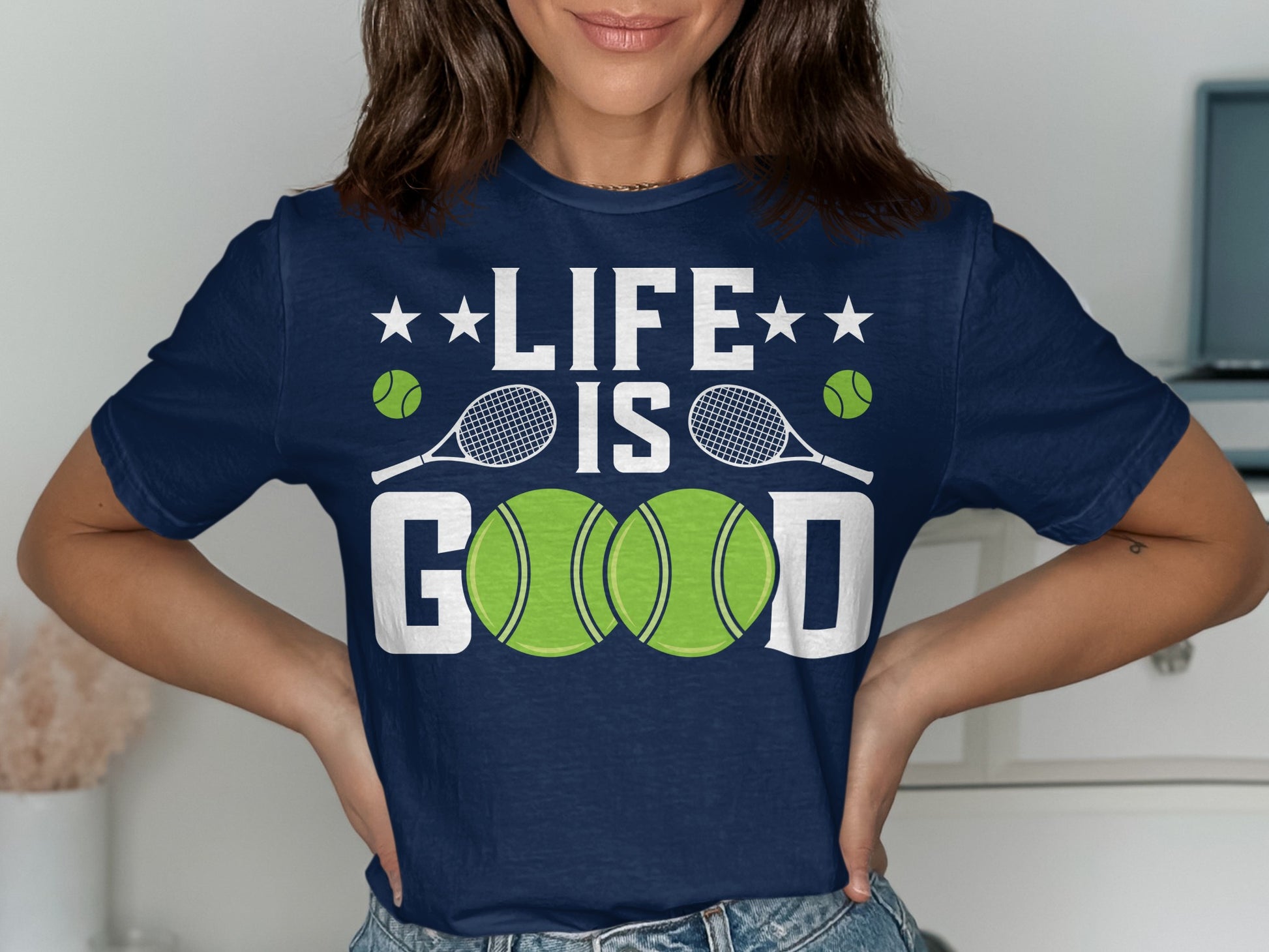 Navy t-shirt with "LIFE IS GOOD" text and tennis balls and racquets.