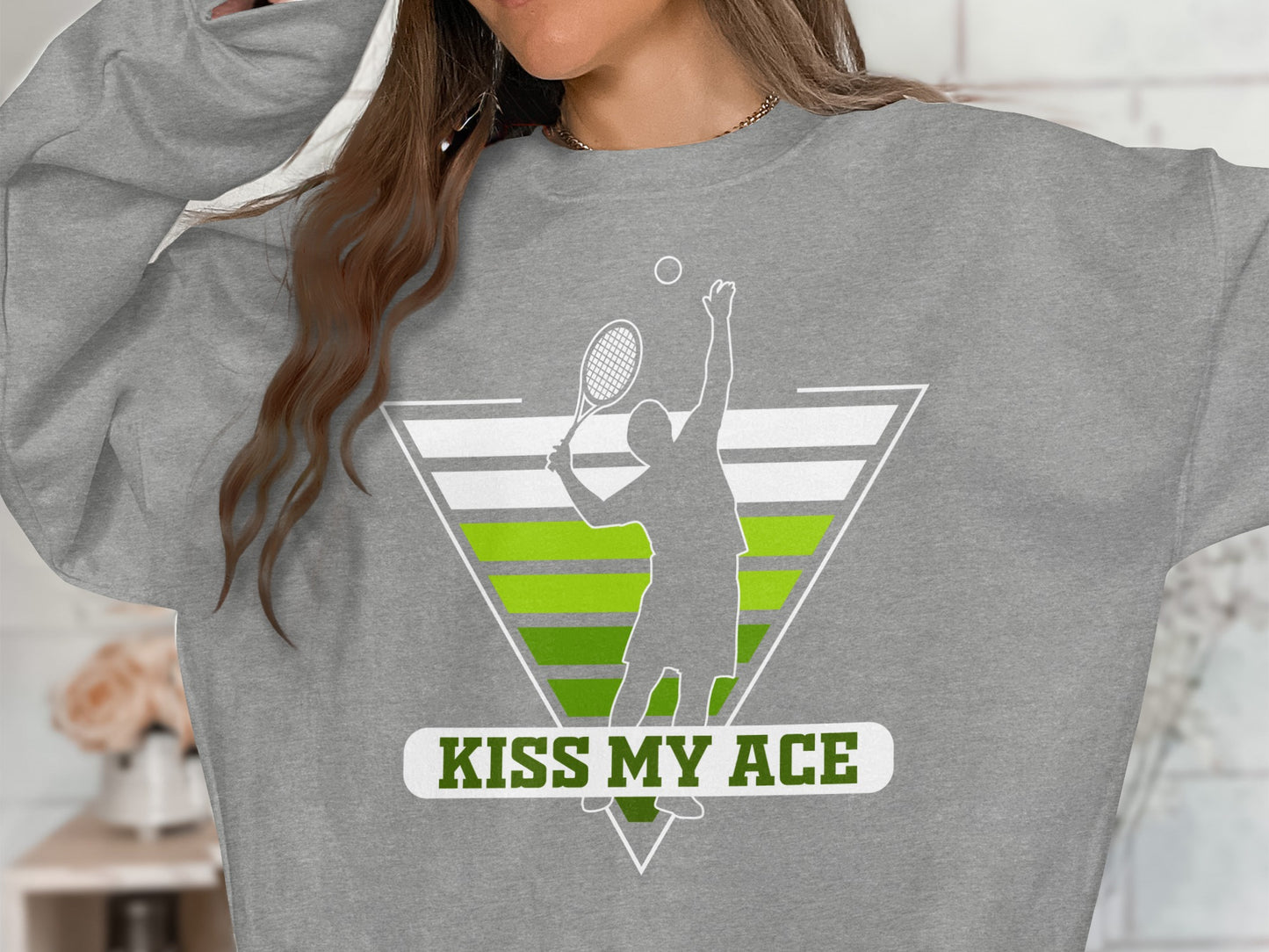 Gray sweatshirt with a tennis player silhouette and "Kiss My Ace" text.