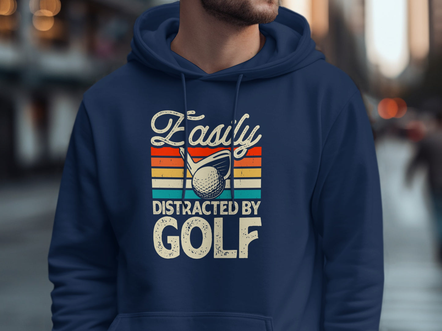 Navy hoodie with "Easily Distracted by GOLF" text and golf ball graphic.