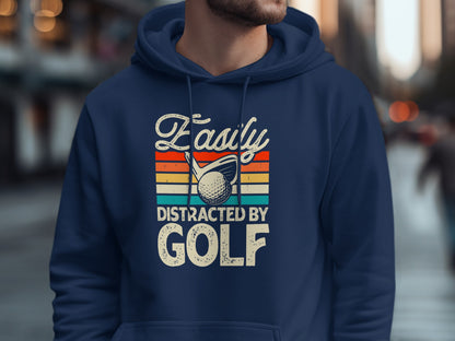 Navy hoodie with "Easily Distracted by GOLF" text and golf ball graphic.