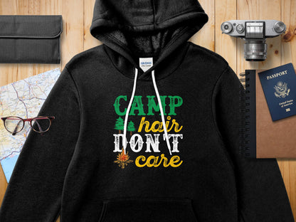 Black Gildan hoodie with "CAMP hair DON'T care" text and pine tree graphic.