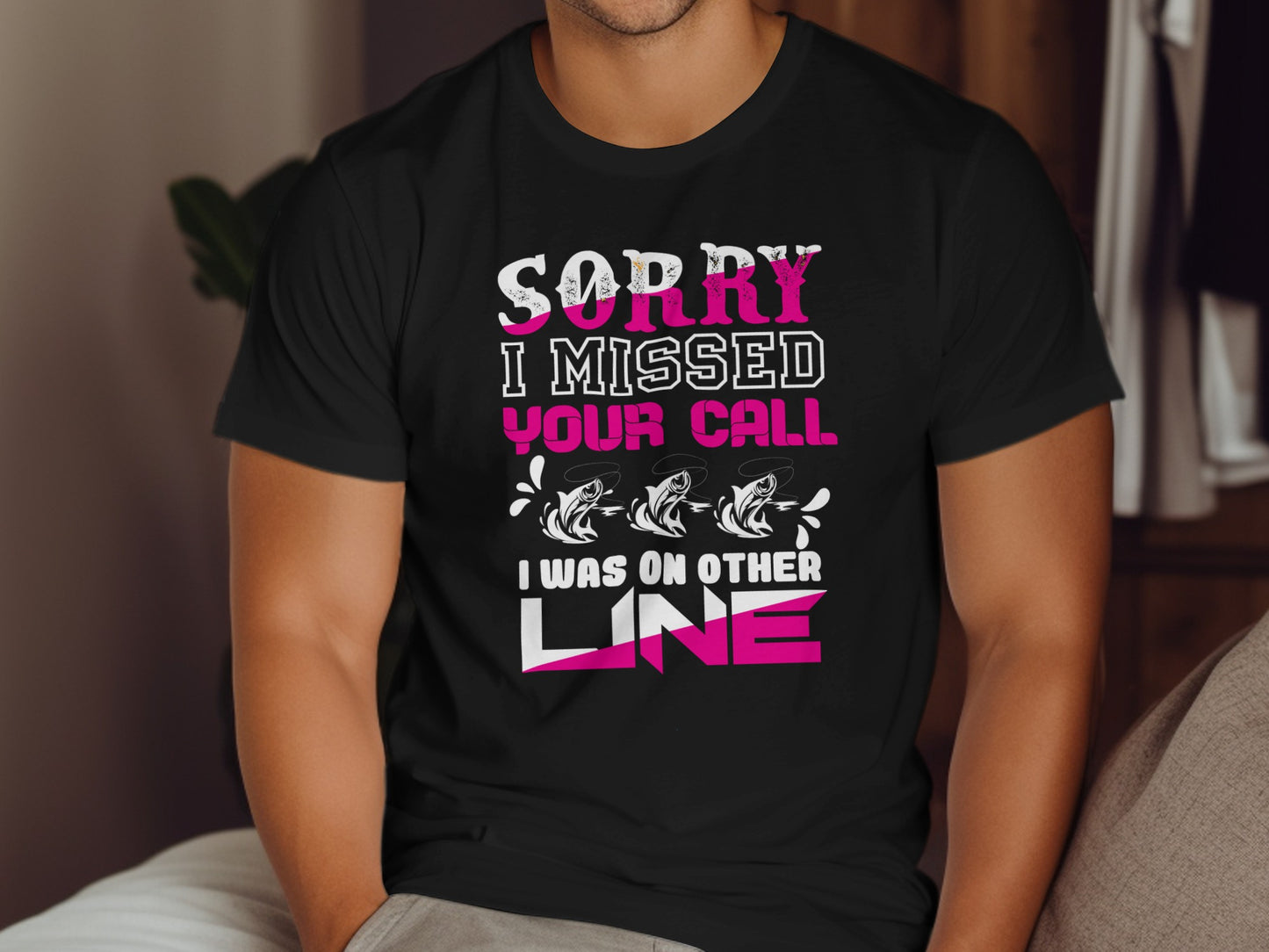 Black t-shirt with "Sorry I missed your call, I was on the line" text and fishing graphics.