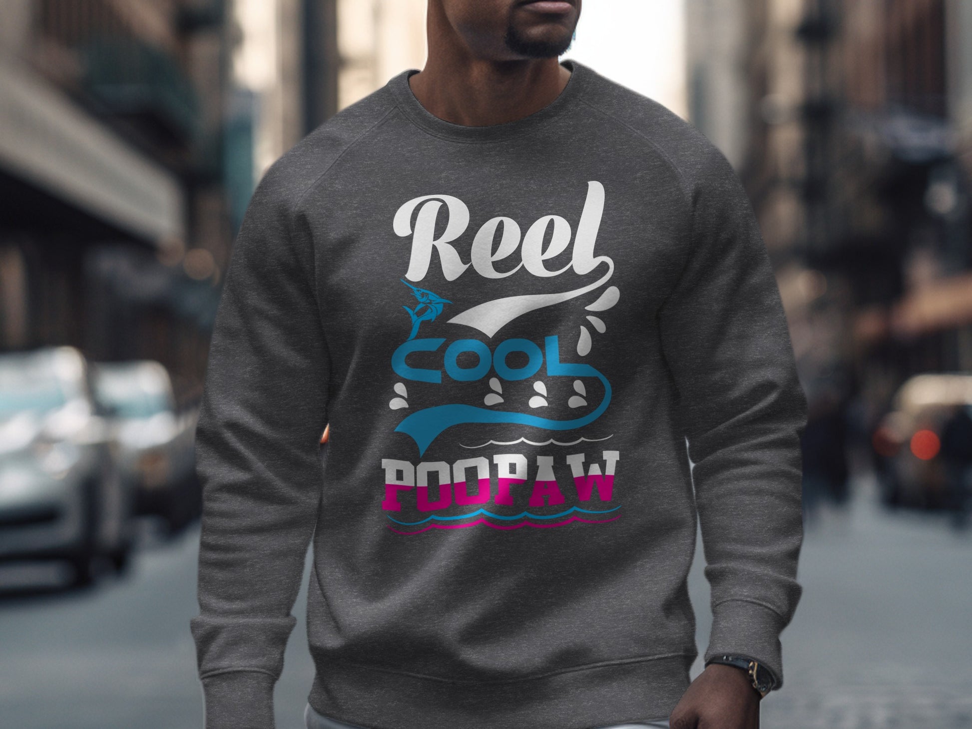 Gray sweatshirt with "Reel Cool Poopaw" text and wave graphic.