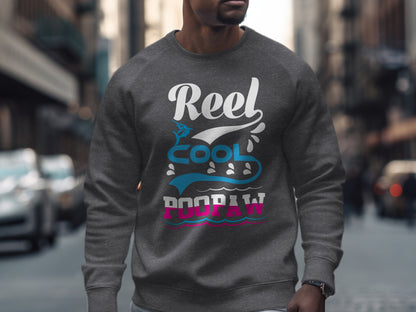 Gray sweatshirt with "Reel Cool Poopaw" text and wave graphic.