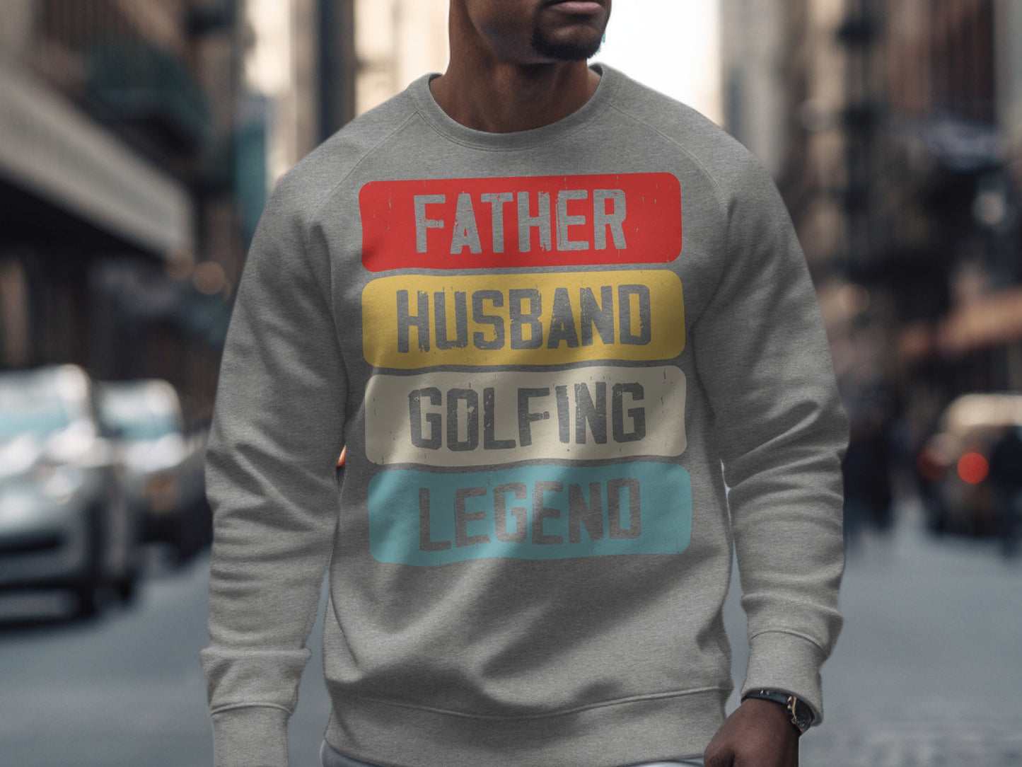 Grey sweatshirt with "Father Husband Golfing Legend" text in colorful blocks.
