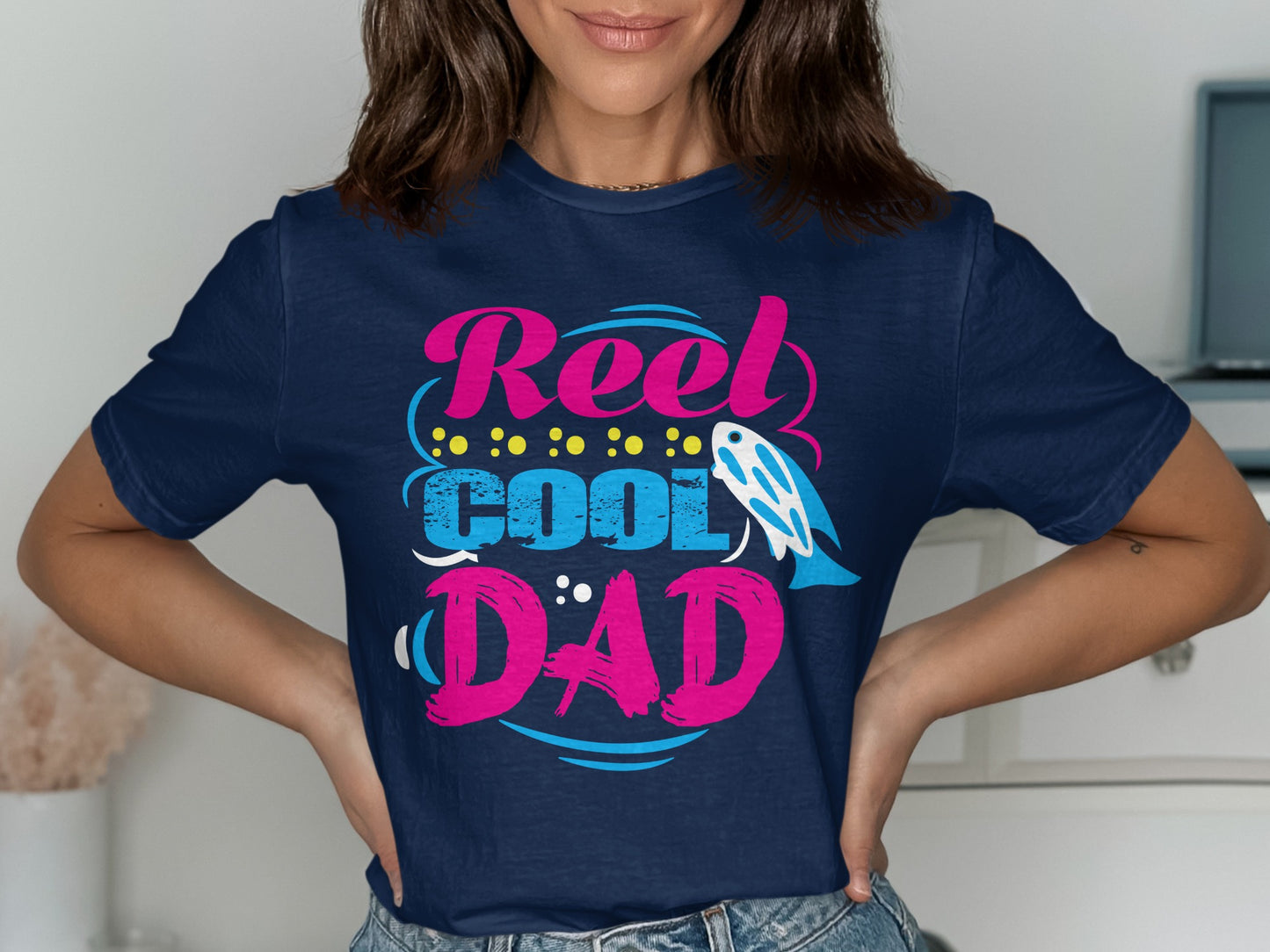 Navy t-shirt with "Reel Cool Dad" text, fish, and polka dots.