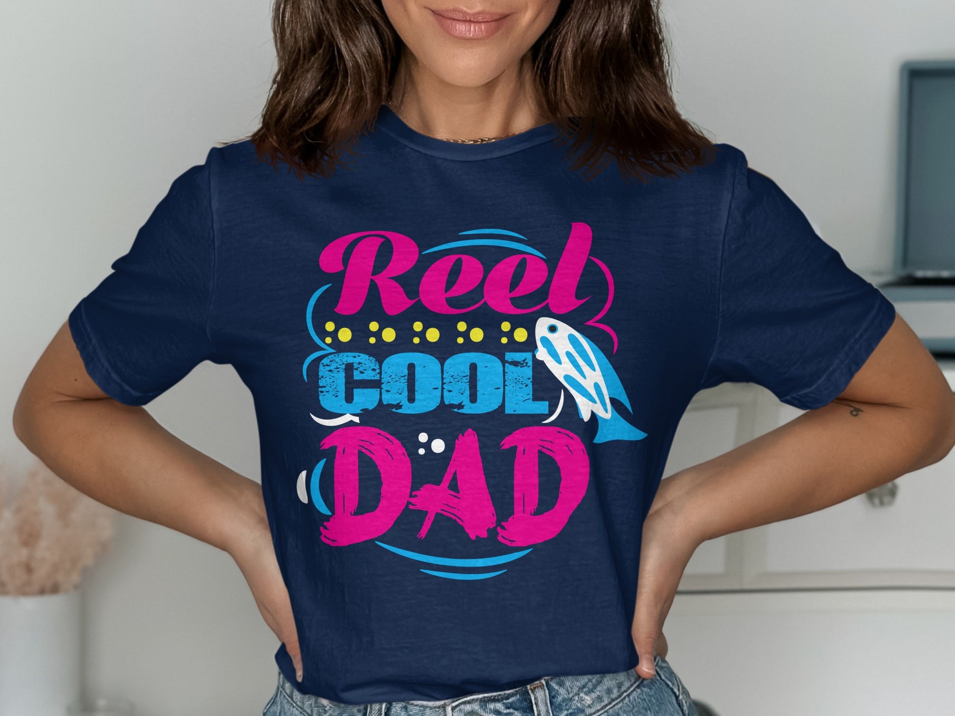 Navy t-shirt with "Reel Cool Dad" text, fish, and polka dots.
