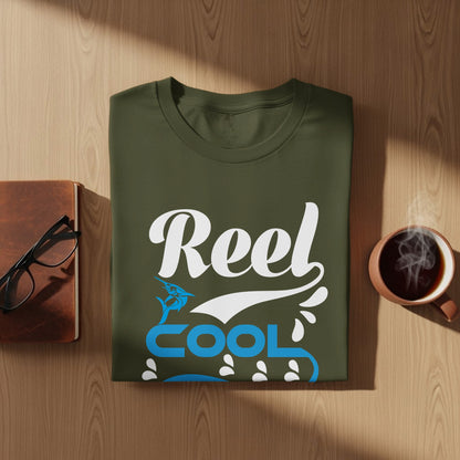 Olive green t-shirt with "Reel Cool" and fish graphic.