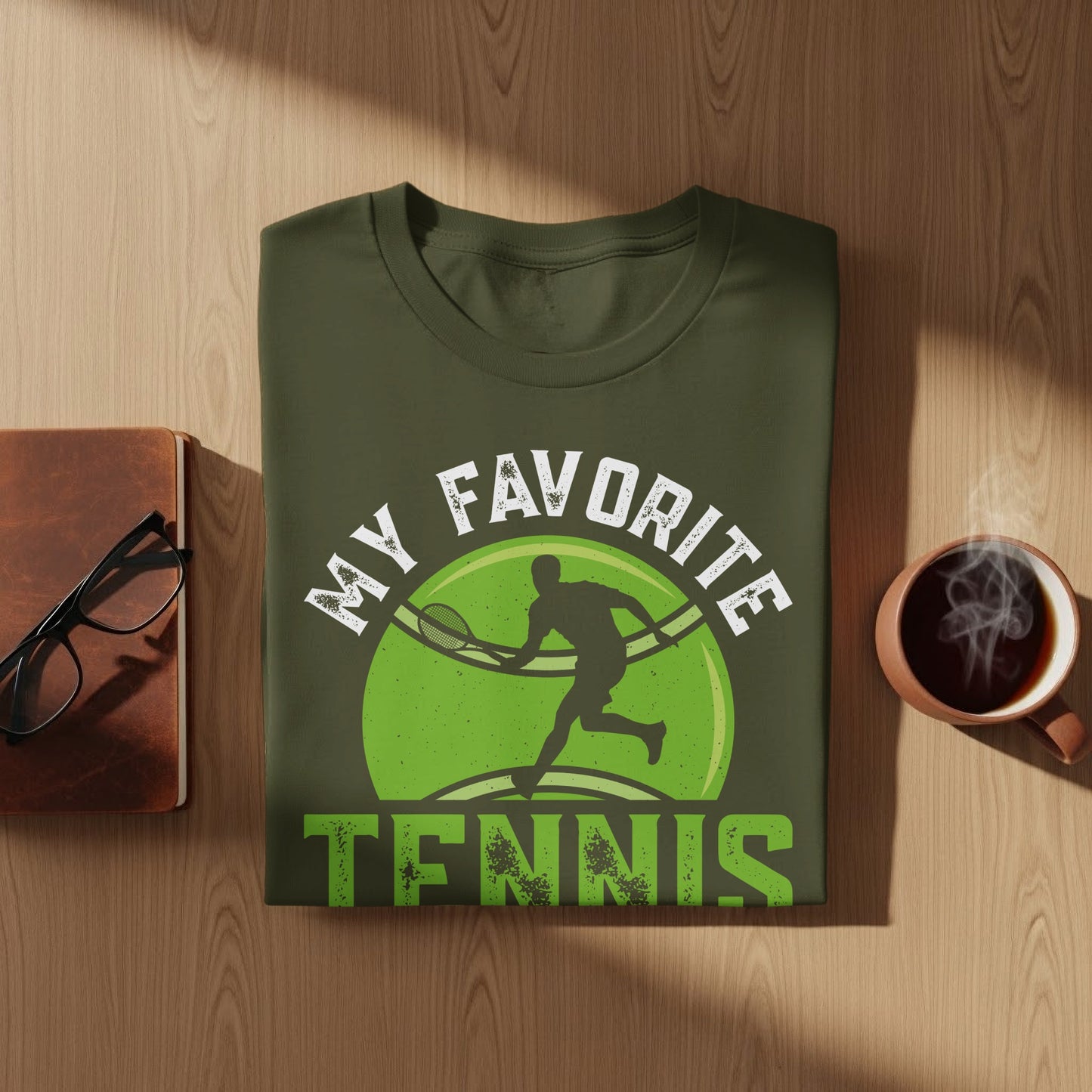 Green t-shirt with tennis player graphic and "MY FAVORITE TENNIS" text.