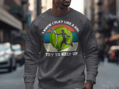 Gray sweatshirt with "I Know I Play Like A Girl Try To Keep Up" and tennis graphic.