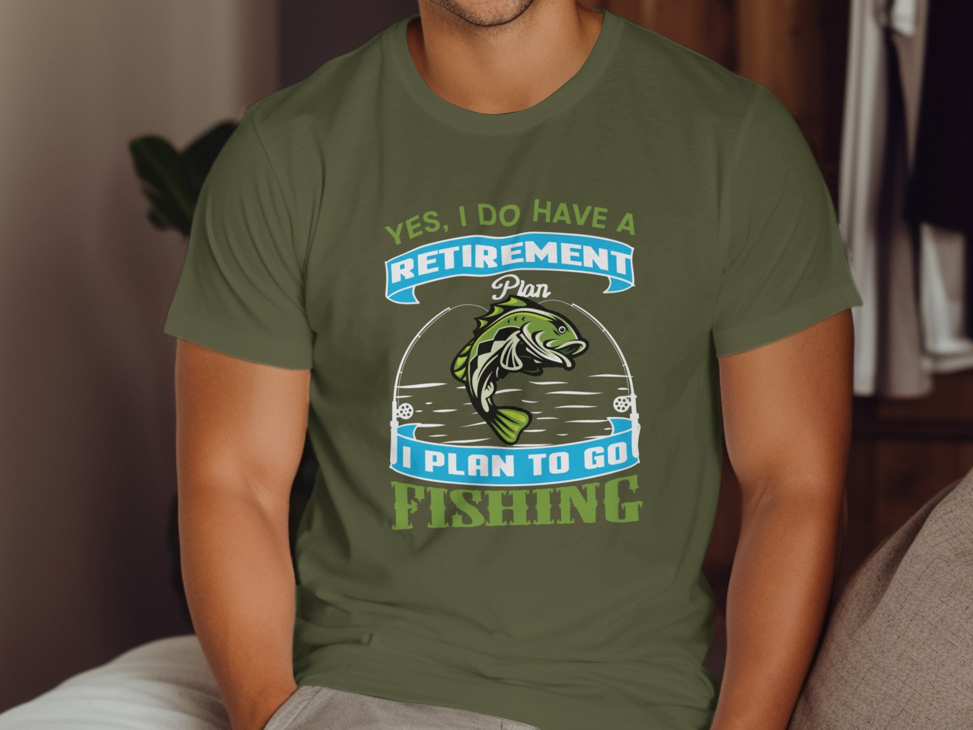 Green t-shirt with "Yes, I do have a retirement plan I plan to go fishing" text and fish graphic.