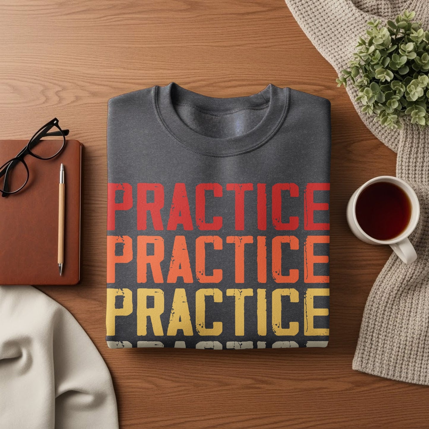 Dark grey sweatshirt with "PRACTICE" repeated in red, orange, and yellow.