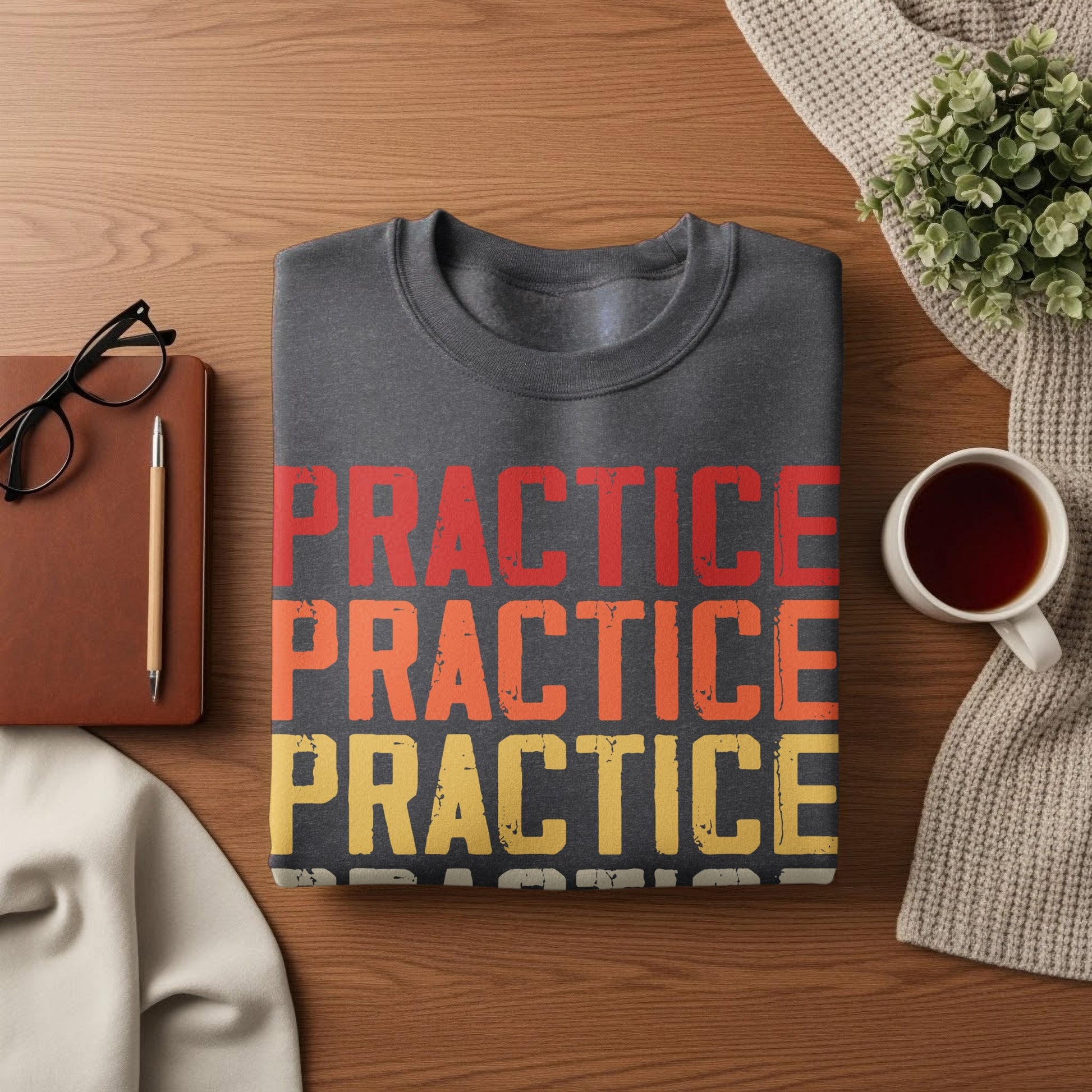 Dark grey sweatshirt with "PRACTICE" repeated in red, orange, and yellow.