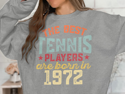Grey sweatshirt with text "THE BEST TENNIS PLAYERS ARE BORN IN 1972".
