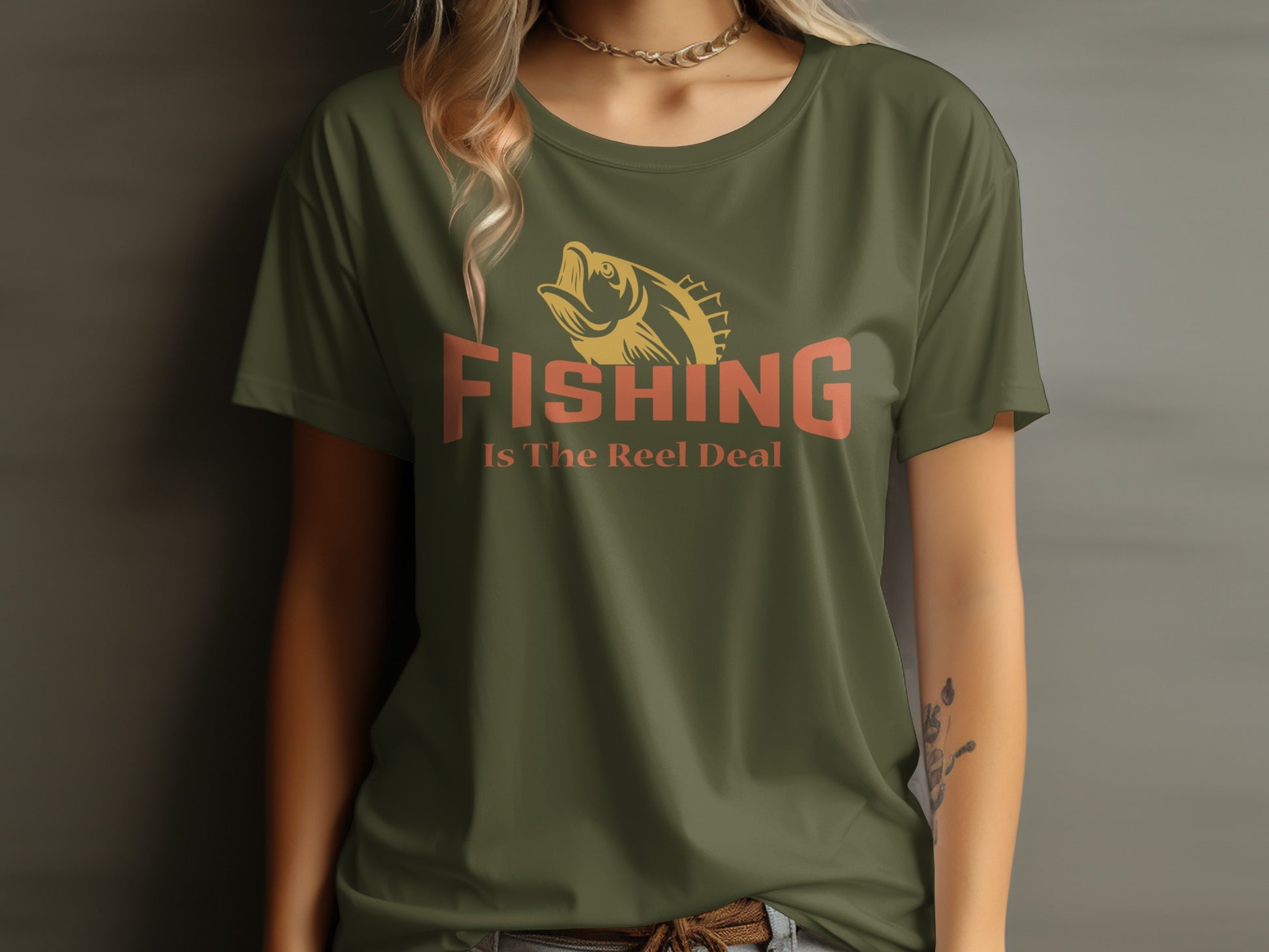 Olive green t-shirt with "FISHING Is The Reel Deal" and fish graphic.