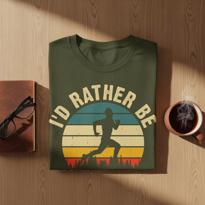 Olive t-shirt with "I'd rather be running" text and runner silhouette on sunset background.