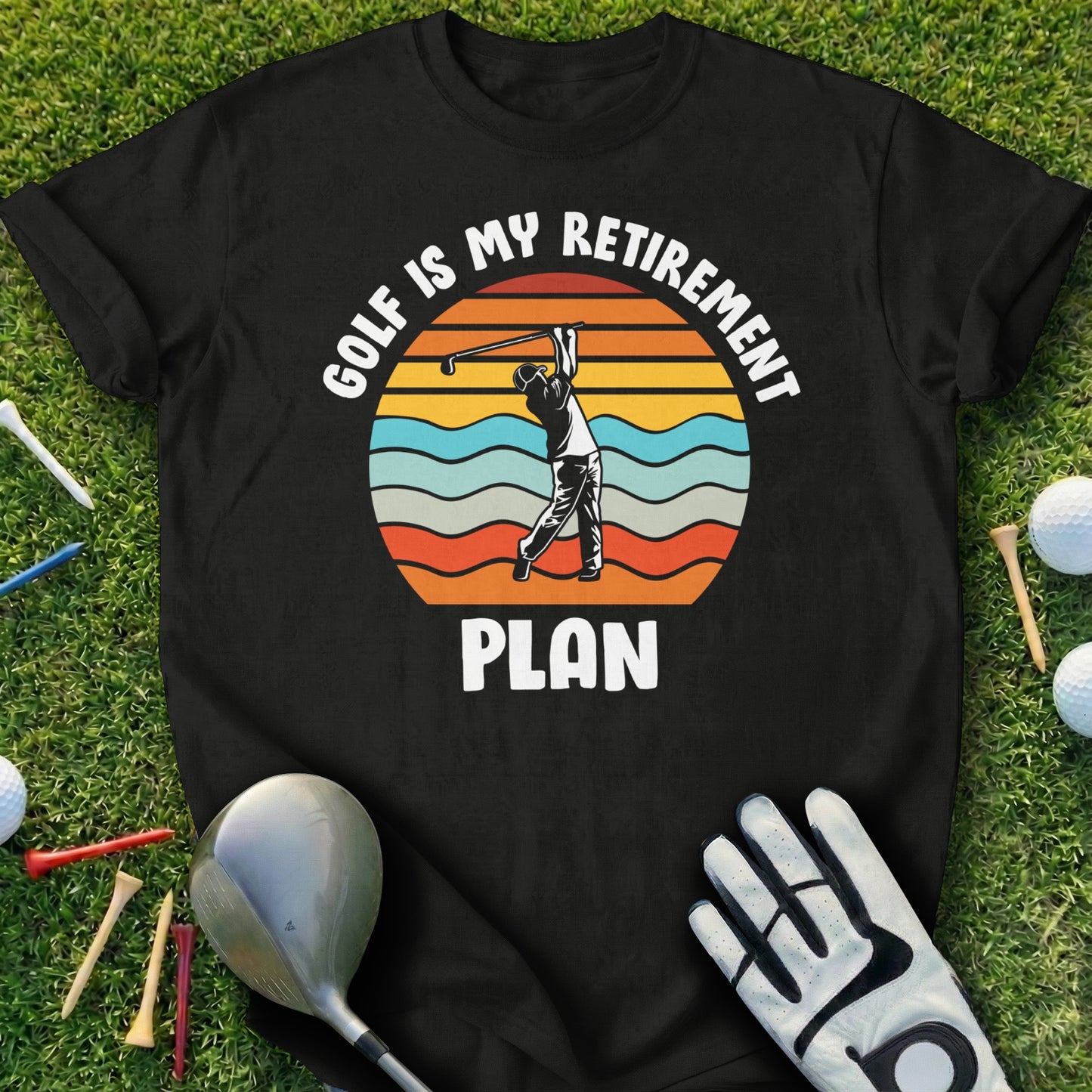 Black t-shirt with "Golf Is My Retirement Plan" text and sunset golf graphic.
